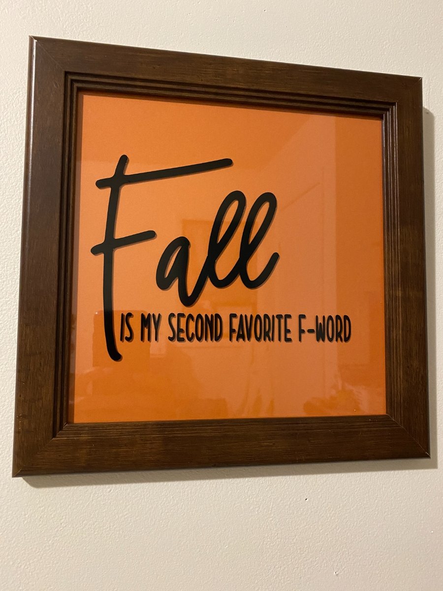 Dark wood picture frame with an orange background and black Cricut-cut letters reading 'Fall is my second favorite F-word'